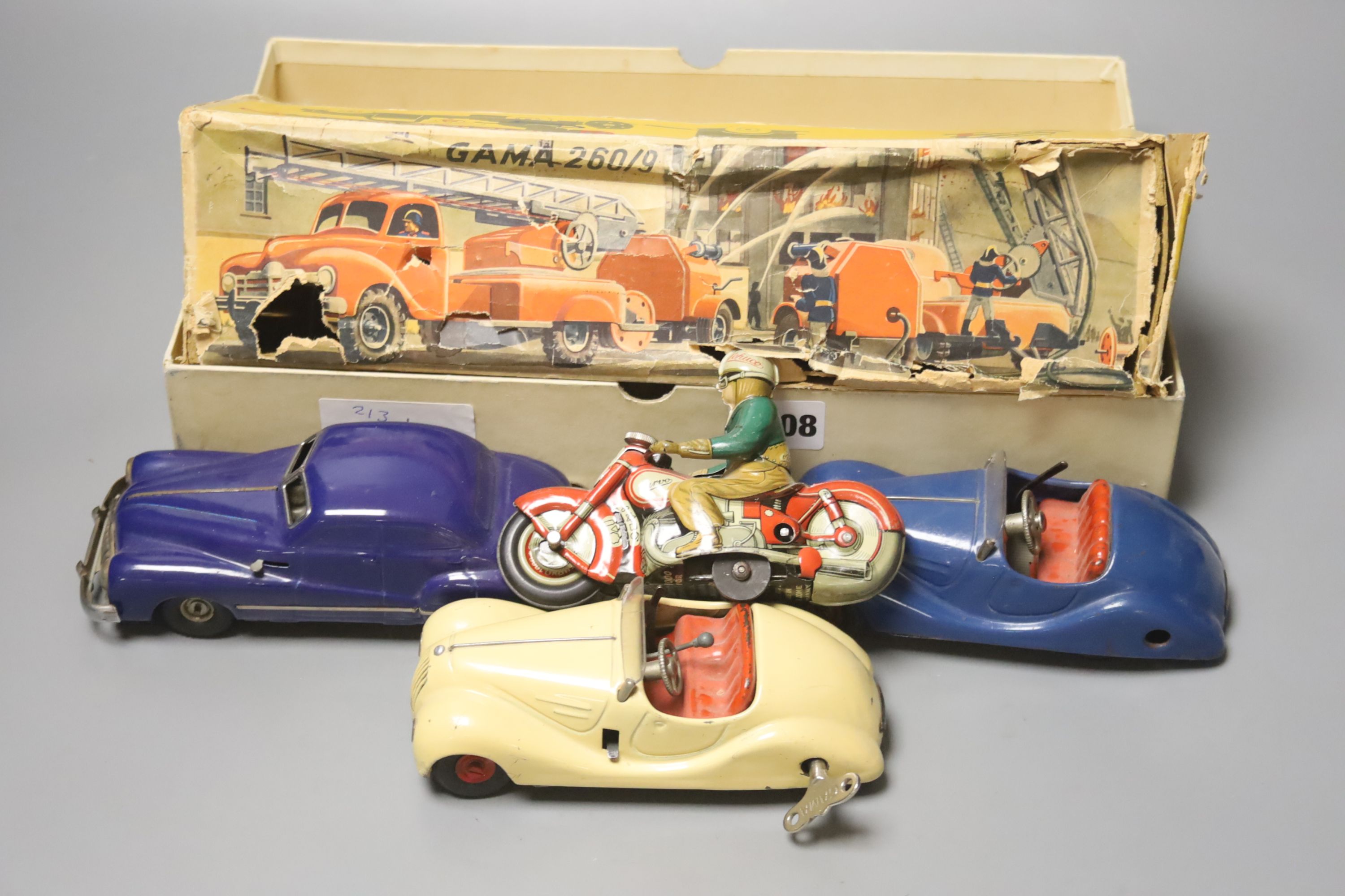 A Schuco Curvo 1000 tinplate motorcycle, A Schuco Akustico 2002, A Schuco Examico 4001 and two Gama vehicles